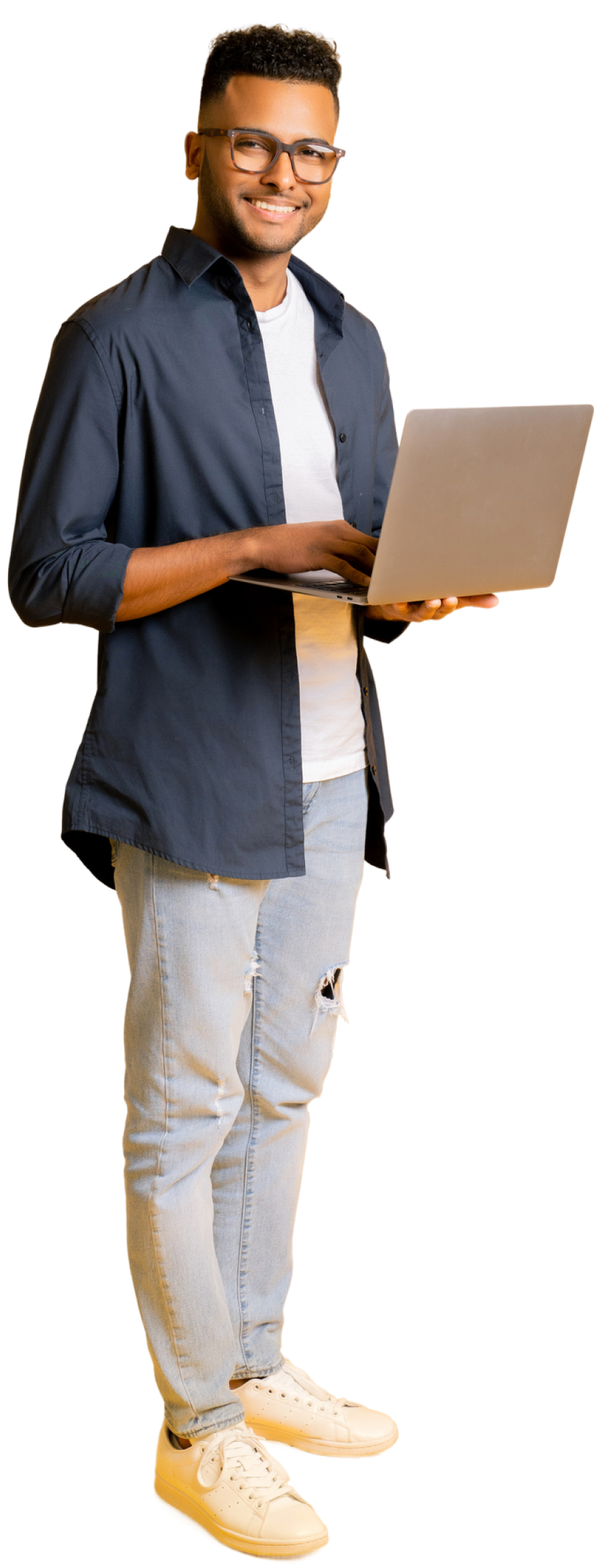 Smiling man standing holding his open laptop